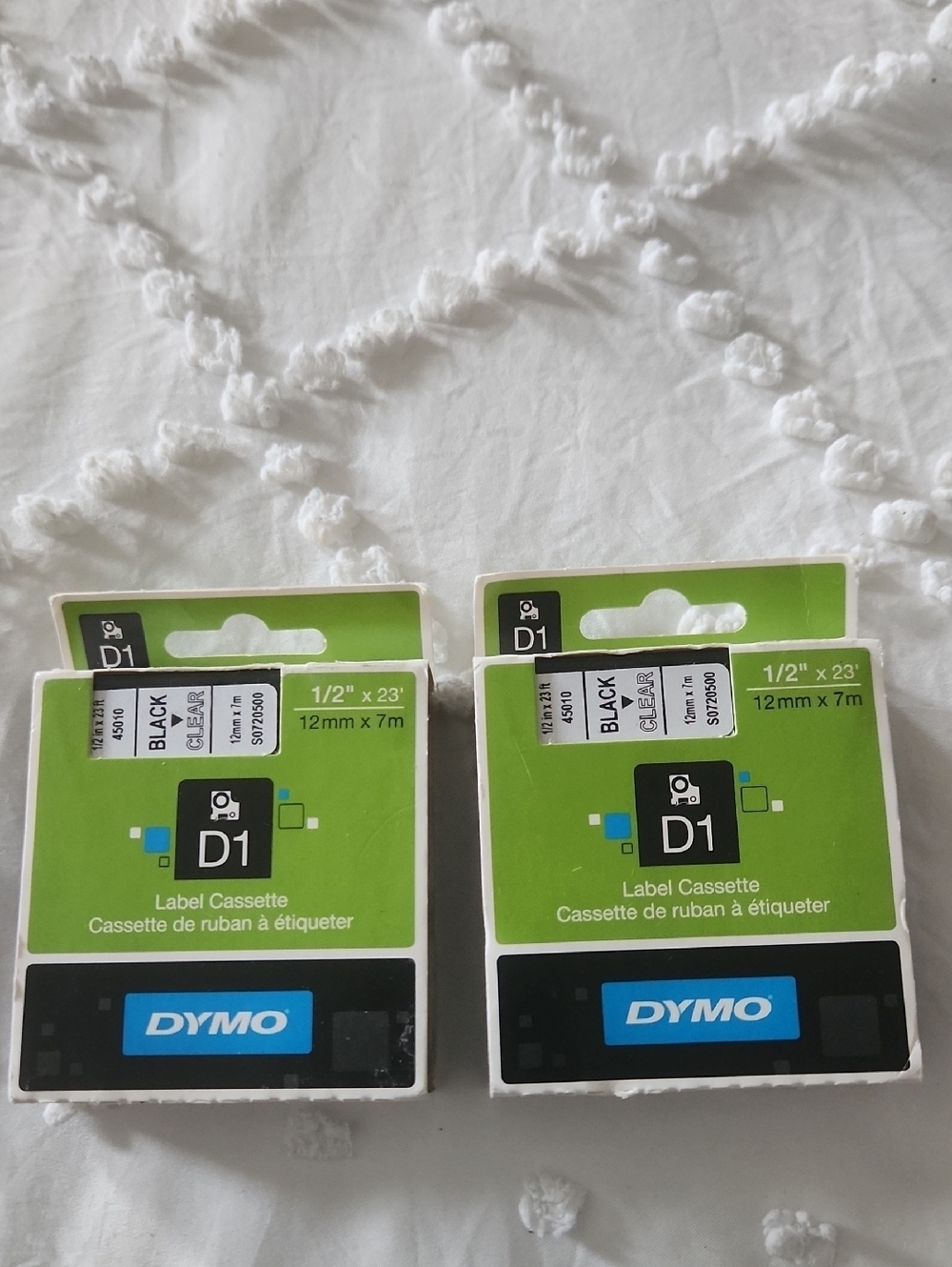 Dymo D1 Label Cassettes in Green and Black Packaging